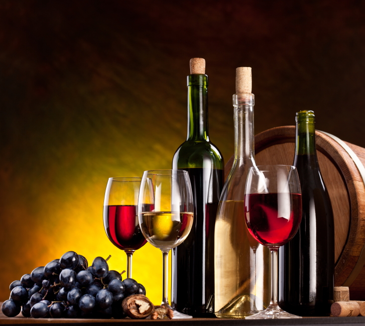 Wine Glasses, Wine Bottles, Grapes and Barrel